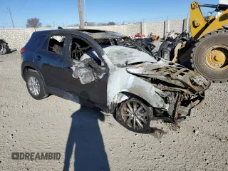 2015 Mazda CX-5 Touring with VIN JM3KE4CYXF0515106, listed as a Copart auction lot 50451185 with 0 mi miles and Salvage Title. Bid and sale history available at carsss.com. Image 4.