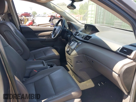 2014 Honda Odyssey Touring with VIN 5FNRL5H90EB082691, listed as a IAAI auction lot 42572977 with 54,413 mi miles and . Bid and sale history available at DreamBid. Image 5.