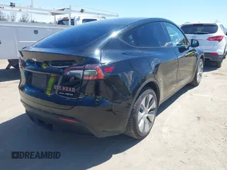 2020 Tesla Model Y Long Range with VIN 5YJYGDEE2LF059177, listed as a IAAI auction lot 41916260 with 66,190 mi miles and . Bid and sale history available at DreamBid. Image 4.