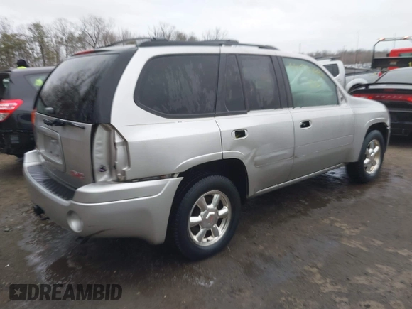 2004 GMC Envoy SLT with VIN 1GKDT13S242398113, listed as a IAAI auction lot 41722942 with 175,173 mi miles and . Bid and sale history available at DreamBid. Image 4.