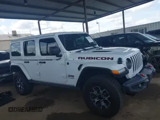 2022 Jeep Wrangler Unlimited Rubicon z VIN 1C4JJXFM6NW234295, wystawiony jako IAAI lot #41906475 z przebiegiem 47 546 mil mil oraz . Historia ofert i sprzedaży dostępna na DreamBid. Obrazek 14.