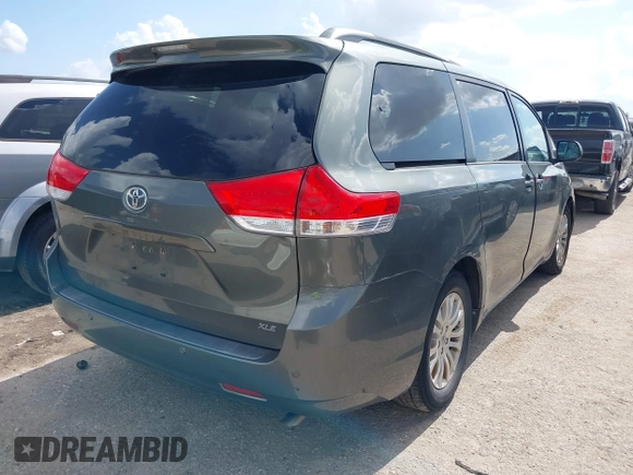 2014 Toyota Sienna XLE with VIN 5TDYK3DC2ES448876, listed as a IAAI auction lot 42519351 with 154,601 mi miles and . Bid and sale history available at DreamBid. Image 4.