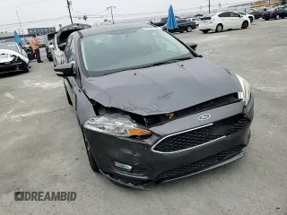2016 Ford Focus SE z VIN 1FADP3F23GL405565, wystawiony jako Copart lot #60173935 z przebiegiem 82 167 mil mil oraz Szkoda całkowita • Salvage title. Historia ofert i sprzedaży dostępna na DreamBid. Obrazek 13.
