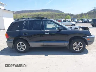 2002 Hyundai Santa Fe GLS z VIN KM8SC73D42U281993, wystawiony jako IAAI lot #42098783 z przebiegiem 256 094 mil mil oraz . Historia ofert i sprzedaży dostępna na DreamBid. Obrazek 13.