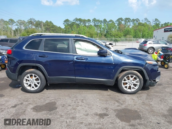 2015 Jeep Cherokee Latitude with VIN 1C4PJLCB5FW694359, listed as a IAAI auction lot 41934213 with 117,723 mi miles and . Bid and sale history available at DreamBid. Image 13.