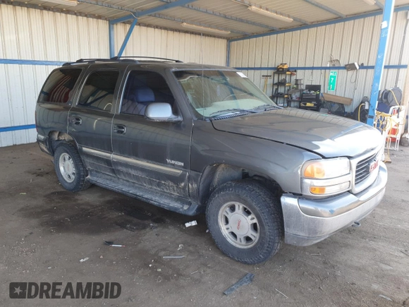 2001 GMC Yukon SLT z VIN 1GKEK13T21J165558, wystawiony jako Copart lot #52200565 z przebiegiem 291 699 mil mil oraz Szkoda całkowita • Salvage title. Historia ofert i sprzedaży dostępna na DreamBid. Obrazek 4.