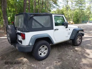 2012 Jeep Wrangler Sport with VIN 1C4AJWAG7CL192200, listed as a IAAI auction lot 42472398 with 198,999 mi miles and . Bid and sale history available at DreamBid. Image 4.