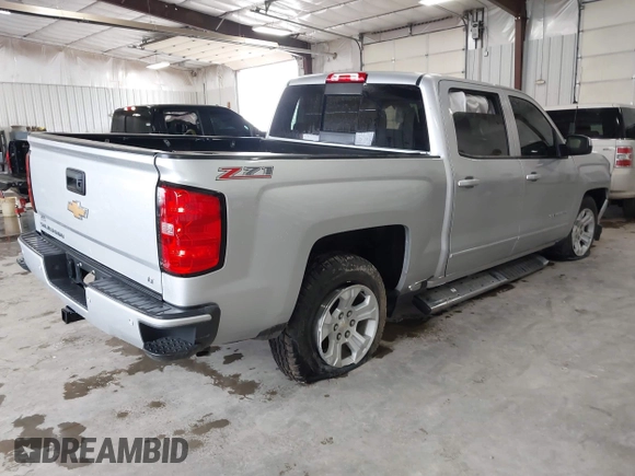 2017 Chevrolet Silverado 1500 LT with VIN 3GCUKREC2HG473554, listed as a IAAI auction lot 42220143 with 80,000 mi miles and . Bid and sale history available at DreamBid. Image 4.