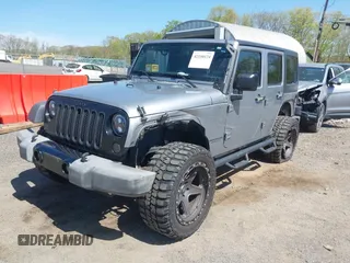 2015 Jeep Wrangler Unlimited Sport z VIN 1C4BJWDG6FL768265, wystawiony jako IAAI lot #42150124 z przebiegiem 85 108 mil mil oraz . Historia ofert i sprzedaży dostępna na DreamBid. Obrazek 2.