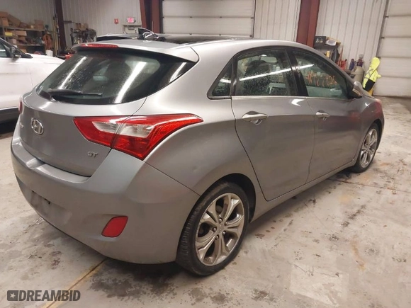 2013 Hyundai Elantra GT with VIN KMHD35LE7DU044309, listed as a IAAI auction lot 41988026 with 128,636 mi miles. Bid and sale history available at carsss.com. Image 4.