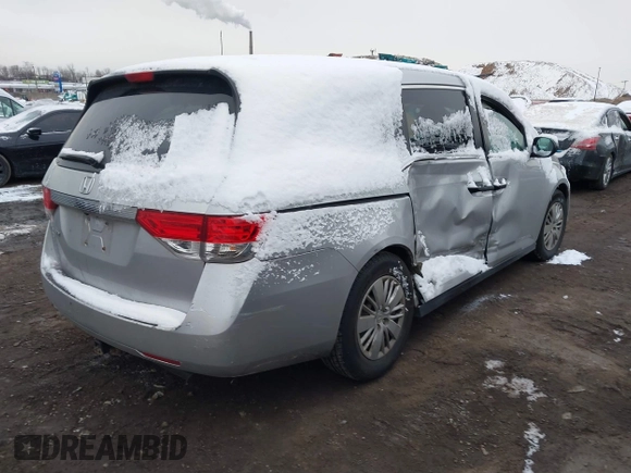 2014 Honda Odyssey LX with VIN 5FNRL5H22EB080346, listed as a IAAI auction lot 41282783 with 101,000 mi miles and . Bid and sale history available at carsss.com. Image 4.