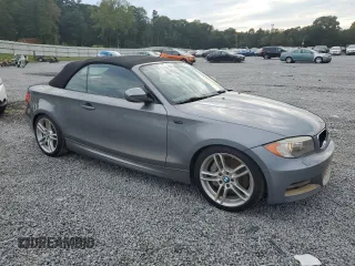 2012 BMW 1 Series 135i with VIN WBAUN7C59CVM26082, listed as a Copart auction lot 74711754 with 77,152 mi miles and Salvage title. Bid and sale history available at DreamBid. Image 4.