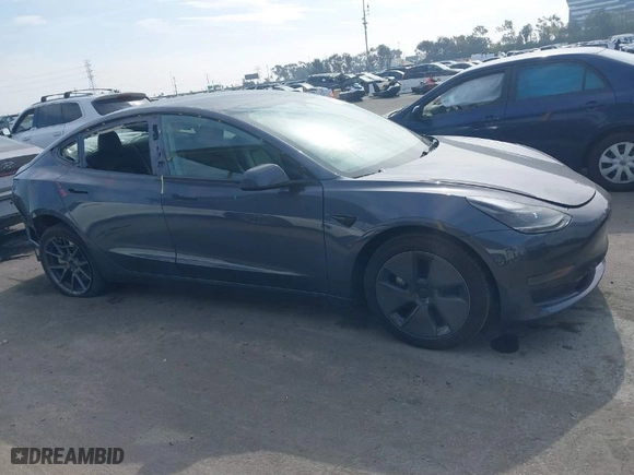 2023 Tesla Model 3 with VIN 5YJ3E1EA0PF577869, listed as a IAAI auction lot 41468956 with 38,760 mi miles. Bid and sale history available at carsss.com. Image 13.