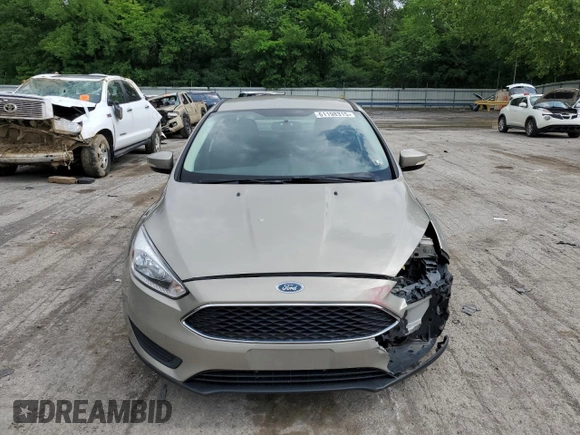 2015 Ford Focus SE z VIN 1FADP3F29FL312757, wystawiony jako Copart lot #61198315 z przebiegiem 84 944 mil mil oraz Szkoda całkowita • Salvage title. Historia ofert i sprzedaży dostępna na DreamBid. Obrazek 5.