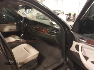 2012 BMW X5 35i with VIN 5UXZV4C55CL990510, listed as a IAAI auction lot 41849293 with 117,522 mi miles and . Bid and sale history available at DreamBid. Image 5.