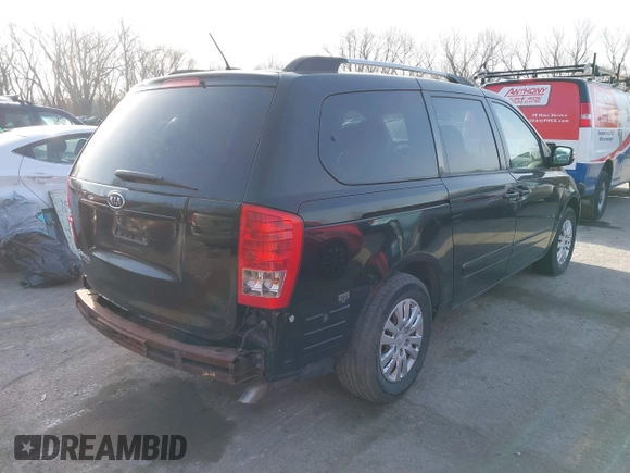 2011 Kia Sedona LX with VIN KNDMG4C70B6411556, listed as a IAAI auction lot 41768777 with 124,180 mi miles. Bid and sale history available at carsss.com. Image 4.
