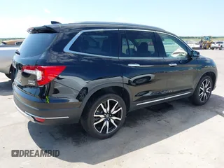 2019 Honda Pilot Touring 7-Passenger with VIN 5FNYF6H67KB031988, listed as a IAAI auction lot 42519588 with 41,368 mi miles and . Bid and sale history available at DreamBid. Image 4.