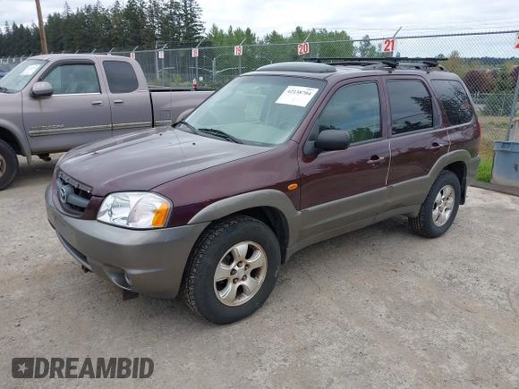 2001 Mazda Tribute LX with VIN 4F2CU08141KM10269, listed as a IAAI auction lot 42138704 with 166,825 mi miles and . Bid and sale history available at carsss.com. Image 2.