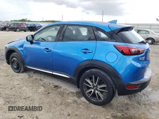 2016 Mazda CX-3 Grand Touring with VIN JM1DKBD72G0106104, listed as a Copart auction lot 52581085 with 76,603 mi miles and Salvage Title. Bid and sale history available at carsss.com. Image 2.