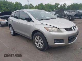 2007 Mazda CX-7 Touring z VIN JM3ER29L770100151, wystawiony jako IAAI lot #42301584 z przebiegiem 131 813 mil mil oraz . Historia ofert i sprzedaży dostępna na DreamBid. Obrazek 1.