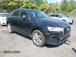 2017 Audi Q3 Premium Plus z VIN WA1JCCFS5HR001068, wystawiony jako IAAI lot #42038452 z przebiegiem 136 661 mil mil oraz . Historia ofert i sprzedaży dostępna na DreamBid. Obrazek 1.