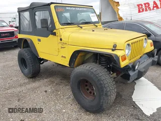 2000 Jeep Wrangler Sport with VIN 1J4FA49S0YP781831, listed as a IAAI auction lot 41694680 with 250,108 mi miles and . Bid and sale history available at DreamBid. Image 1.