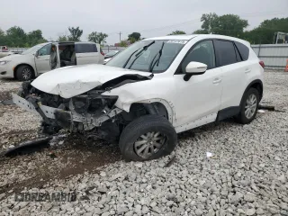 2016 Mazda CX-5 Touring с VIN JM3KE4CY7G0707973, выставлен на аукционе Copart как лот 59141615 с пробегом Не указан миль и Списание • Salvage title. История ставок и продаж доступна на DreamBid. Изображение 1.