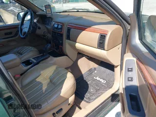 1999 Jeep Grand Cherokee Limited z VIN 1J4GW68N5XC630910, wystawiony jako IAAI lot #42380978 z przebiegiem 188 300 mil mil oraz . Historia ofert i sprzedaży dostępna na DreamBid. Obrazek 5.