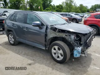 2020 Toyota RAV4 Hybrid XLE with VIN 2T3RWRFV3LW076759, listed as a Copart auction lot 60330435 with 128,274 mi miles and Salvage title. Bid and sale history available at DreamBid. Image 4.