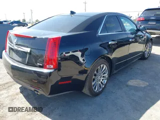 2012 Cadillac CTS Performance z VIN 1G6DJ5E30C0156576, wystawiony jako IAAI lot #42287858 z przebiegiem 106 497 mil mil oraz . Historia ofert i sprzedaży dostępna na DreamBid. Obrazek 4.