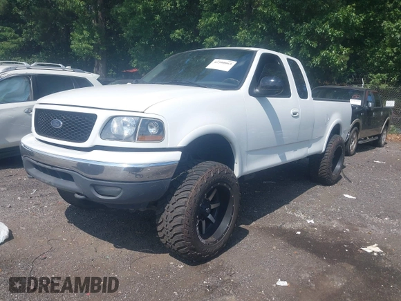 2001 Ford F-150 XL with VIN 1FTRX18L71NB11026, listed as a IAAI auction lot 42590063 with 218,156 mi miles and . Bid and sale history available at DreamBid. Image 2.