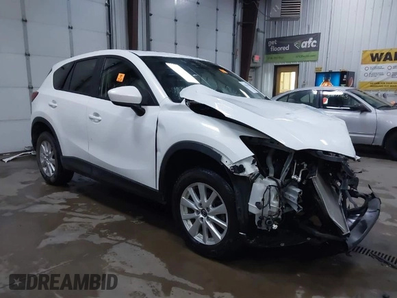 2014 Mazda CX-5 Touring with VIN JM3KE4CY4E0349034, listed as a IAAI auction lot 41478954 with 117,502 mi miles. Bid and sale history available at carsss.com. Image 1.