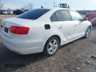2013 Volkswagen Jetta TDI w/Premium with VIN 3VWLL7AJ6DM422102, listed as a IAAI auction lot 41956935 with 143,385 mi miles and . Bid and sale history available at DreamBid. Image 4.