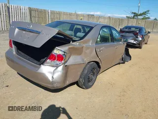 2006 Toyota Camry STD z VIN 4T1BE30K06U126692, wystawiony jako IAAI lot #42335766 z przebiegiem 74 000 mil mil oraz . Historia ofert i sprzedaży dostępna na DreamBid. Obrazek 4.