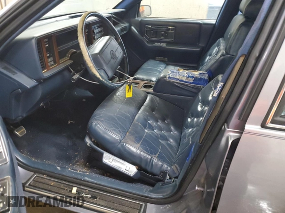 1991 Cadillac Seville z VIN 1G6KS53B2MU809384, wystawiony jako Copart lot #77185134 z przebiegiem 134 769 mil mil oraz Szkody całkowita. Historia ofert i sprzedaży dostępna na DreamBid. Obrazek 7.