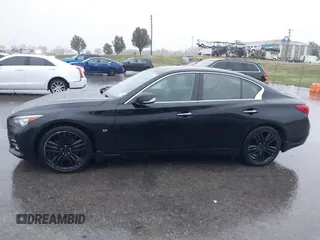 2015 Infiniti Q50 Premium z VIN JN1BV7ARXFM412382, wystawiony jako IAAI lot #40776813 z przebiegiem 66 406 mil mil oraz . Historia ofert i sprzedaży dostępna na DreamBid. Obrazek 14.
