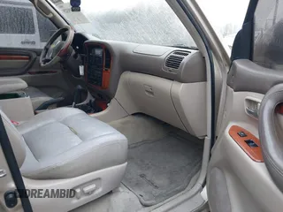 1999 Lexus LX 470 z VIN JT6HT00W4X0056023, wystawiony jako IAAI lot #41319329 z przebiegiem 206 974 mil mil oraz . Historia ofert i sprzedaży dostępna na DreamBid. Obrazek 5.