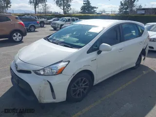 2017 Toyota Prius v Two with VIN JTDZN3EU9HJ063285, listed as a IAAI auction lot 41696704 with 411,285 mi miles. Bid and sale history available at carsss.com. Image 2.