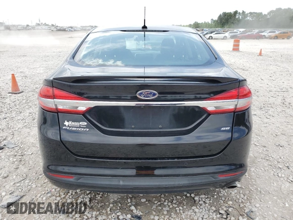 2017 Ford Fusion SE z VIN 3FA6P0H75HR228505, wystawiony jako Copart lot #53251205 z przebiegiem 144 898 mil mil oraz Czysty tytuł • Clean title. Historia ofert i sprzedaży dostępna na DreamBid. Obrazek 6.