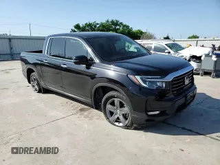 2023 Honda Ridgeline RTL-E with VIN 5FPYK3F72PB001592, listed as a Copart auction lot 52154625 with 41,153 mi miles and Salvage title. Bid and sale history available at DreamBid. Image 11.