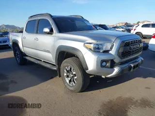 2018 Toyota Tacoma SR with VIN 3TMCZ5AN1JM141605, listed as a IAAI auction lot 41558201 with 91,855 mi miles. Bid and sale history available at carsss.com. Image 1.
