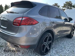 2011 Porsche Cayenne S with VIN WP1AB2A22BLA47332, listed as a Copart auction lot 65087385 with 112,033 mi miles and Salvage title. Bid and sale history available at DreamBid. Image 4.