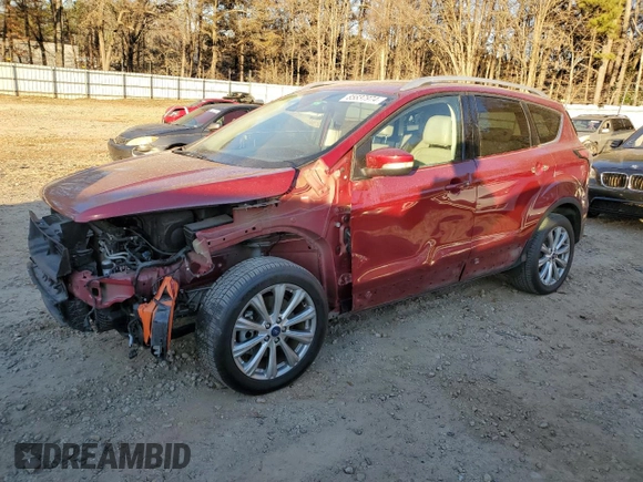 2017 Ford Escape Titanium with VIN 1FMCU0J94HUD34112, listed as a Copart auction lot 85837974 with 127,576 mi miles and Salvage Title. Bid and sale history available at carsss.com. Image 1.