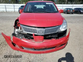 2009 Nissan Versa S z VIN 3N1BC13E19L410760, wystawiony jako Copart lot #55303895 z przebiegiem 84 014 mil mil oraz Szkoda całkowita • Salvage title. Historia ofert i sprzedaży dostępna na DreamBid. Obrazek 11.