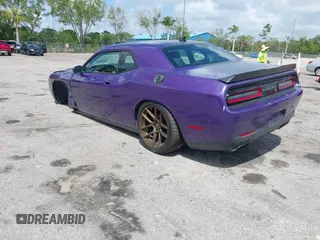 2016 Dodge Challenger R/T Plus Shaker z VIN 2C3CDZBTXGH191823, wystawiony jako IAAI lot #41881157 z przebiegiem 98 577 mil mil oraz . Historia ofert i sprzedaży dostępna na DreamBid. Obrazek 3.