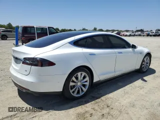 2014 Tesla Model S 60 with VIN 5YJSA1H19EFP58677, listed as a Copart auction lot 61446345 with 150,152 mi miles and Salvage title. Bid and sale history available at DreamBid. Image 3.