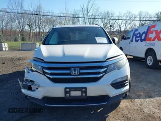 2016 Honda Pilot Touring with VIN 5FNYF6H98GB017079, listed as a IAAI auction lot 42055272 with 142,726 mi miles and . Bid and sale history available at DreamBid. Image 13.