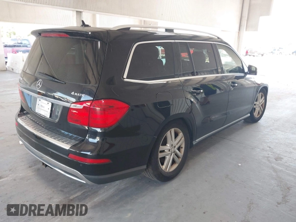 2014 Mercedes-Benz GL 450 z VIN 4JGDF7CE7EA435479, wystawiony jako IAAI lot #42280243 z przebiegiem 138 930 mil mil oraz . Historia ofert i sprzedaży dostępna na DreamBid. Obrazek 4.