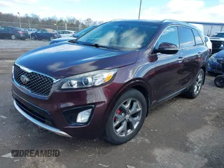 2016 Kia Sorento SX with VIN 5XYPKDA58GG002304, listed as a IAAI auction lot 41990332 with 132,025 mi miles. Bid and sale history available at carsss.com. Image 2.