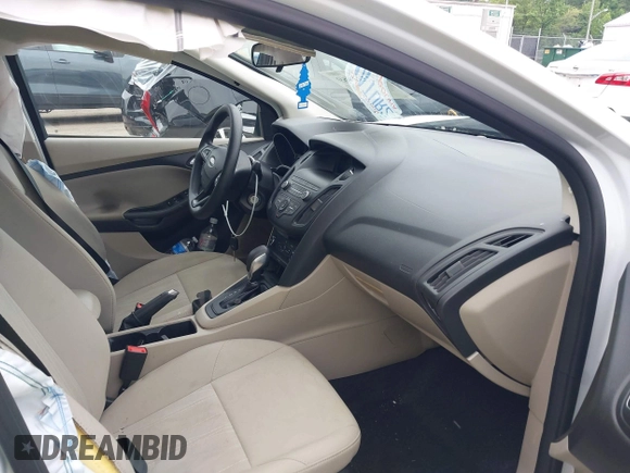 2018 Ford Focus SE z VIN 1FADP3F24JL247003, wystawiony jako IAAI lot #42531969 z przebiegiem 55 344 mil mil oraz . Historia ofert i sprzedaży dostępna na DreamBid. Obrazek 5.